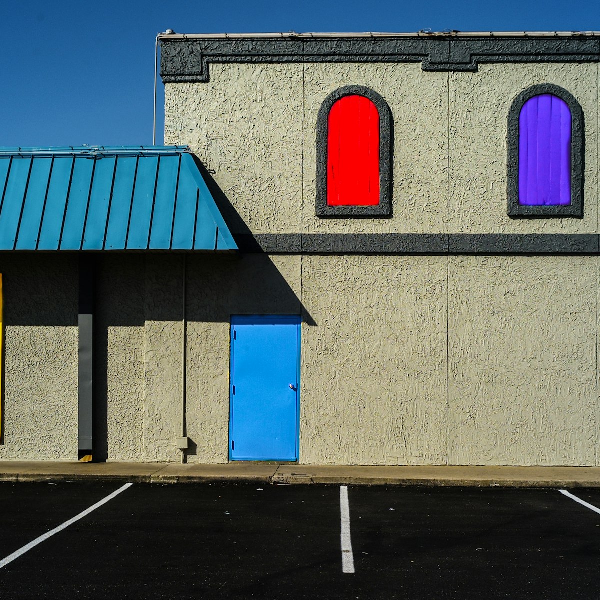 Commercial warehouse exterior typical of the Texas businesses served by deregulated retail electric providers.