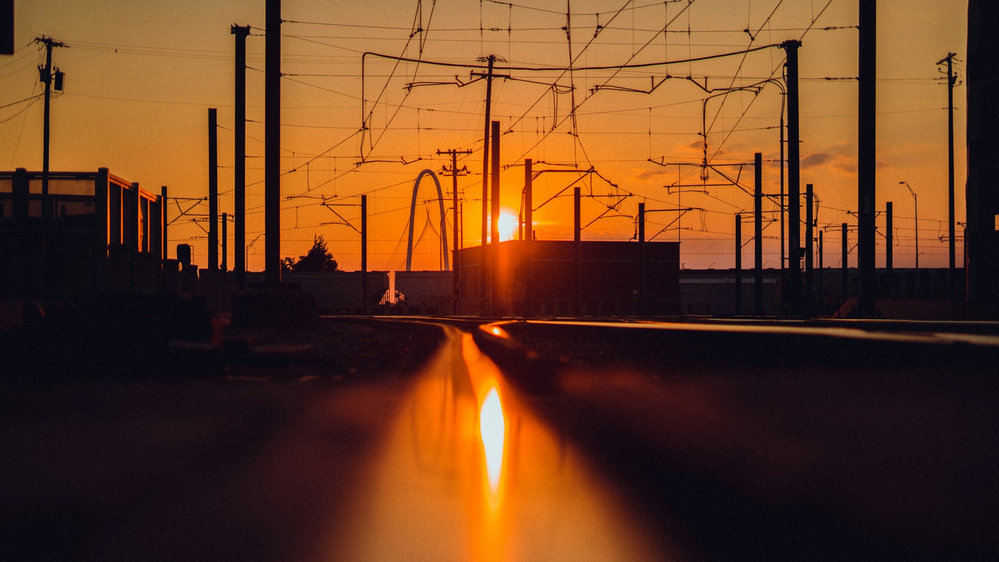 Texas electricity transmission infrastructure at sunset, representing the ERCOT commercial market